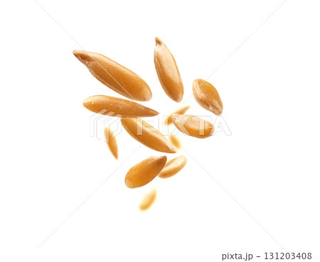 Flax seeds are levitated on a white background 131203408