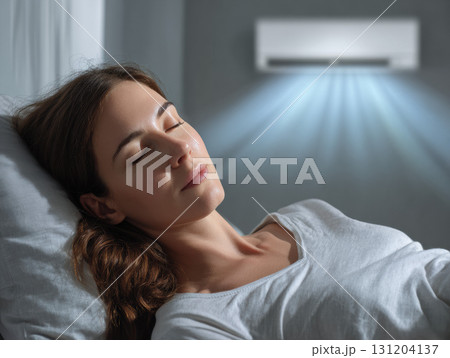 Calm woman sleeping with fresh air from modern air conditioner. comfortable bedroom climate controlled for restful night with sustainable energy technology 131204137