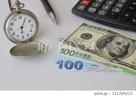 Dollar and old clock. Selective Focus. Dollar and old clock. Selective Focus. 131204223