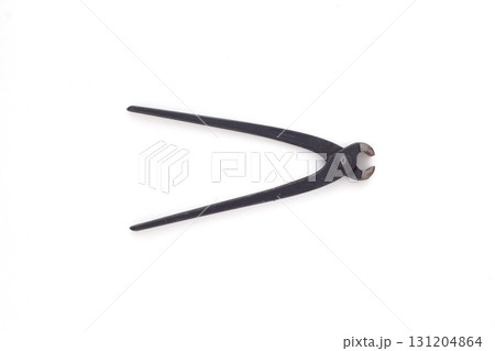 Craftsman tools isolated. Old open rusty pinching pliers to used for removing nails from wood Craftsman tools isolated. Old open rusty pinching pliers to used for removing nails from wood 131204864