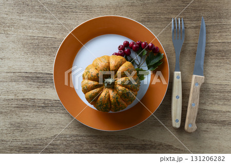 Thanksgiving concept with pumpkin and viburnum branch 131206282