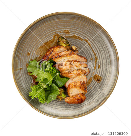 Isolated chicken breast with vegetables and sauce Isolated chicken breast with vegetables and sauce 131206309