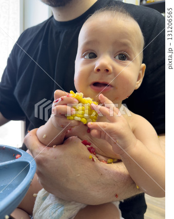 Baby Enjoying Corn on the Cob Baby Enjoying Corn on the Cob 131206565