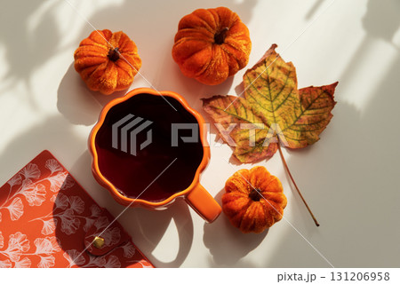 Autumn Flat Lay with Coffee Mug, Pumpkins and Seasonal Decor Autumn Flat Lay with Coffee Mug, Pumpkins and Seasonal Decor 131206958