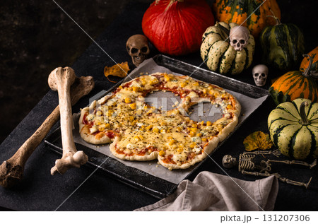 Halloween scary pizza in shape of ghost Halloween scary pizza in shape of ghost 131207306