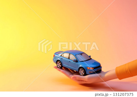blue car model in hand on orange background with space for text, car buying concept 131207375