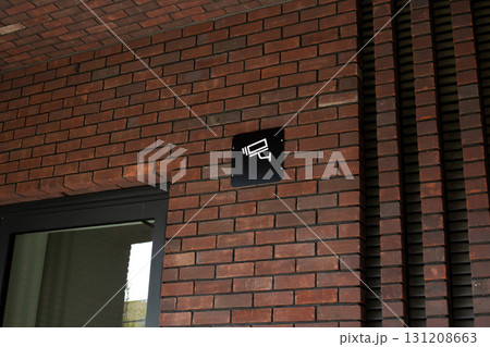 Security camera sign, emphasizing importance of surveillance for both private and commercial spaces. Highlighting role of technology in modern safety measures and crime prevention Security camera sign, emphasizing importance of surveillance for both private and commercial spaces. Highlighting role of technology in modern safety measures and crime prevention 131208663