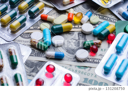 Prescription drugs on a money banknotes. Concept of healthcare cost Prescription drugs on a money banknotes. Concept of healthcare cost 131208750