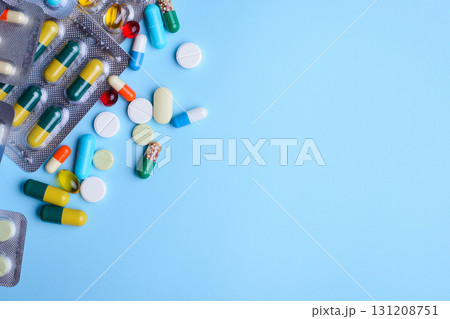 Background of pills, capsules, drugs on light blue background Background of pills, capsules, drugs on light blue background 131208751