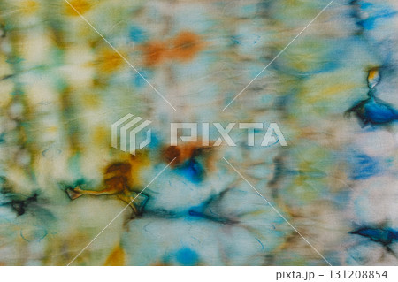 abstract pattern on silk fabric texture in blue, yellow, green colors abstract pattern on silk fabric texture in blue, yellow, green colors 131208854