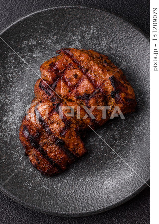 Meat, juicy beef steak grilled cooked to perfection for lunch. Barbecued steak Meat, juicy beef steak grilled cooked to perfection for lunch. Barbecued steak 131209079