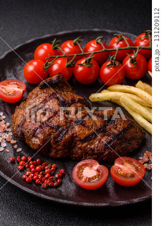 Meat, juicy beef steak grilled cooked to perfection for lunch. Barbecued steak 131209112