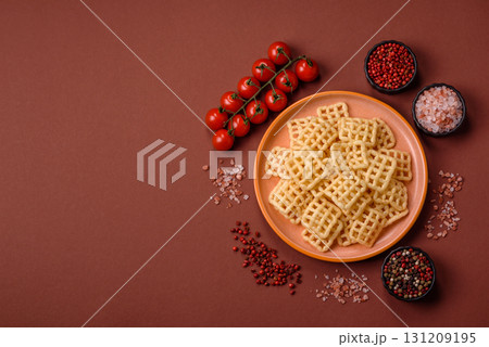 Lattice or wafer potato chips, crispy yellow snacks, takeaway food 131209195