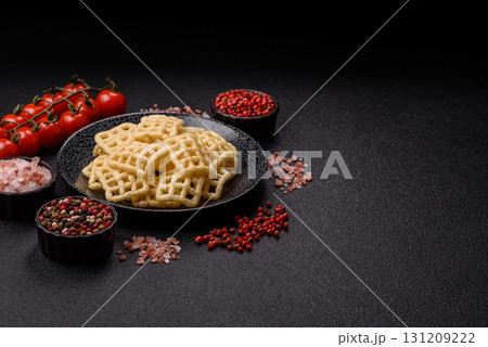 Lattice or wafer potato chips, crispy yellow snacks, takeaway food Lattice or wafer potato chips, crispy yellow snacks, takeaway food 131209222