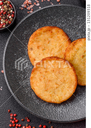 Hash browns, a breakfast food made of potatoes, onions and vegetables. Hash browns with potatoes 131209318