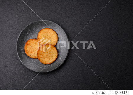 Hash browns, a breakfast food made of potatoes, onions and vegetables. Hash browns with potatoes Hash browns, a breakfast food made of potatoes, onions and vegetables. Hash browns with potatoes 131209325