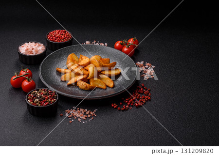 Grilled potato wedges with rosemary, cheese, salt and spices. Baked potato slices Grilled potato wedges with rosemary, cheese, salt and spices. Baked potato slices 131209820
