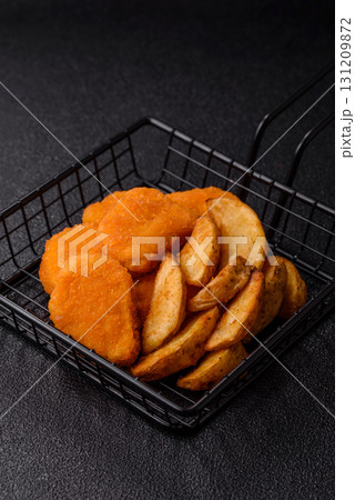 Crispy chicken nuggets, meat takeaway meal with salt. Chicken nuggets, fast food 131209872