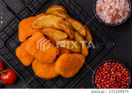 Crispy chicken nuggets, meat takeaway meal with salt. Chicken nuggets, fast food 131209874