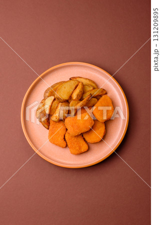 Crispy chicken nuggets, meat takeaway meal with salt. Chicken nuggets, fast food 131209895