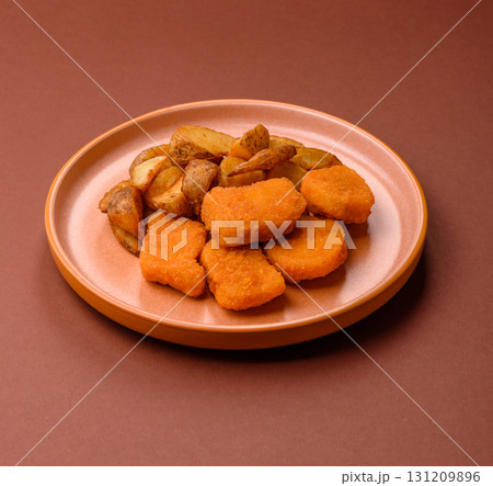 Crispy chicken nuggets, meat takeaway meal with salt. Chicken nuggets, fast food 131209896