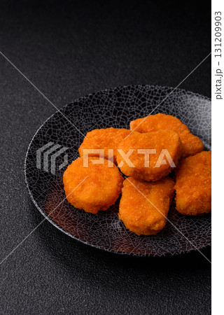 Crispy chicken nuggets, meat takeaway meal with salt. Chicken nuggets, fast food 131209903