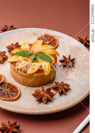 Sweet round pie or tart with apples and peach. Mini sweet tart 131209968