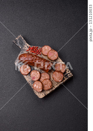Homemade meat or vegan sausage grilled with spices. Homemade sausage cooked on barbecue Homemade meat or vegan sausage grilled with spices. Homemade sausage cooked on barbecue 131210033
