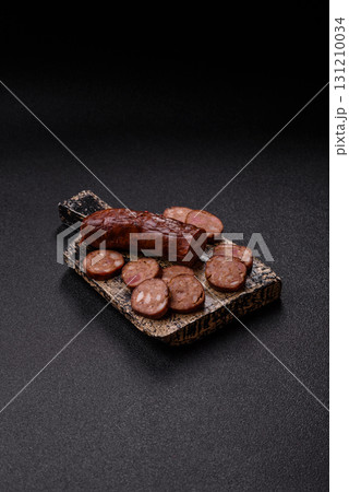 Homemade meat or vegan sausage grilled with spices. Homemade sausage cooked on barbecue Homemade meat or vegan sausage grilled with spices. Homemade sausage cooked on barbecue 131210034
