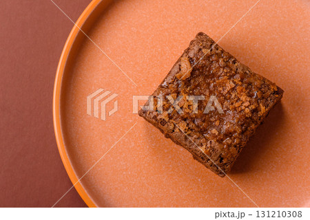 Chocolate brownie cake, food, sweet dessert with nuts rectangular shape. Sweet chocolate brownie Chocolate brownie cake, food, sweet dessert with nuts rectangular shape. Sweet chocolate brownie 131210308