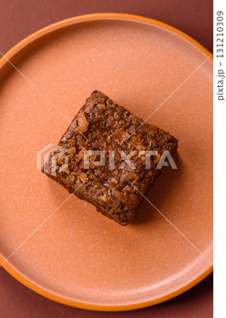 Chocolate brownie cake, food, sweet dessert with nuts rectangular shape. Sweet chocolate brownie 131210309