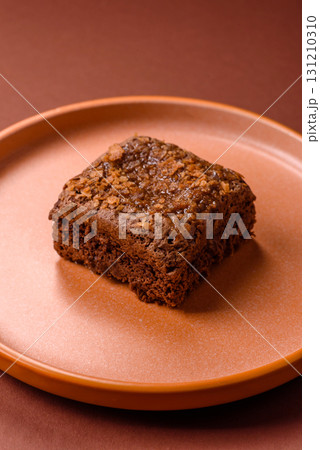 Chocolate brownie cake, food, sweet dessert with nuts rectangular shape. Sweet chocolate brownie Chocolate brownie cake, food, sweet dessert with nuts rectangular shape. Sweet chocolate brownie 131210310