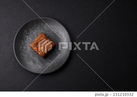 Chocolate brownie cake, food, sweet dessert with nuts rectangular shape. Sweet chocolate brownie 131210332