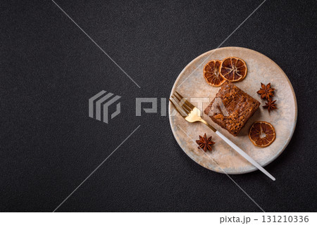 Chocolate brownie cake, food, sweet dessert with nuts rectangular shape. Sweet chocolate brownie Chocolate brownie cake, food, sweet dessert with nuts rectangular shape. Sweet chocolate brownie 131210336