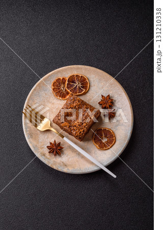 Chocolate brownie cake, food, sweet dessert with nuts rectangular shape. Sweet chocolate brownie Chocolate brownie cake, food, sweet dessert with nuts rectangular shape. Sweet chocolate brownie 131210338