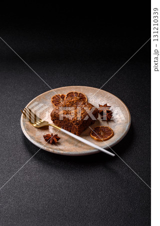 Chocolate brownie cake, food, sweet dessert with nuts rectangular shape. Sweet chocolate brownie Chocolate brownie cake, food, sweet dessert with nuts rectangular shape. Sweet chocolate brownie 131210339