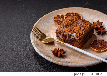 Chocolate brownie cake, food, sweet dessert with nuts rectangular shape. Sweet chocolate brownie Chocolate brownie cake, food, sweet dessert with nuts rectangular shape. Sweet chocolate brownie 131210340