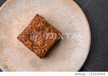 Chocolate brownie cake, food, sweet dessert with nuts rectangular shape. Sweet chocolate brownie Chocolate brownie cake, food, sweet dessert with nuts rectangular shape. Sweet chocolate brownie 131210345