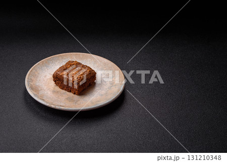 Chocolate brownie cake, food, sweet dessert with nuts rectangular shape. Sweet chocolate brownie Chocolate brownie cake, food, sweet dessert with nuts rectangular shape. Sweet chocolate brownie 131210348
