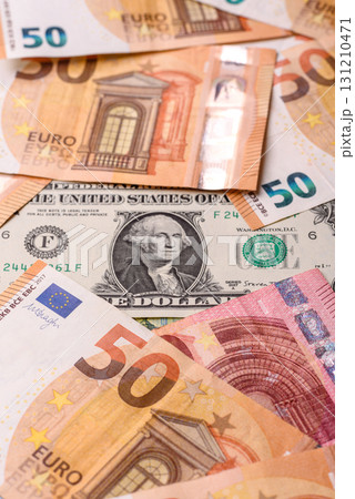 Paper money, euro and dollar bills, exchange rate fluctuations. Paper cash euros and dollars as a financial background 131210471