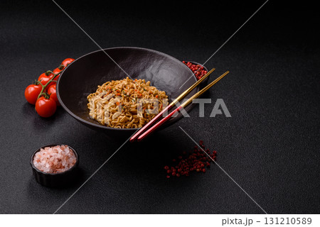 Instant noodles or ramen, Asian food, pasta with vegetables. Noodles, takeaway food Instant noodles or ramen, Asian food, pasta with vegetables. Noodles, takeaway food 131210589