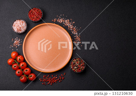 Empty ceramic plate on a monochrome brown background. Empty plate Empty ceramic plate on a monochrome brown background. Empty plate 131210630