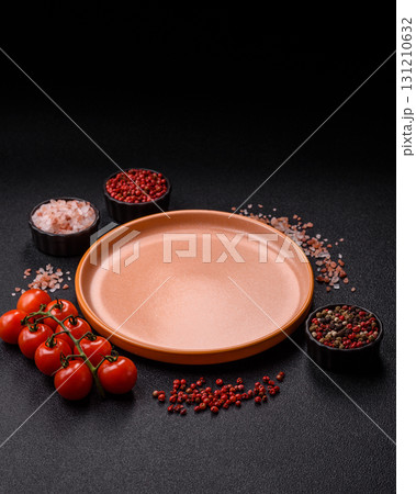 Empty ceramic plate on a monochrome brown background. Empty plate 131210632