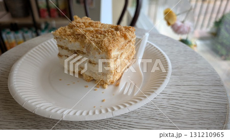 A Delicious Slice of Cake Beautifully Positioned on a Plate for Maximum Enjoyment A Delicious Slice of Cake Beautifully Positioned on a Plate for Maximum Enjoyment 131210965