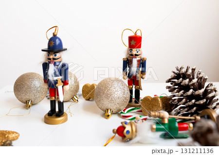 Festive nutcracker decorations with glitter ornaments and pinecones 131211136