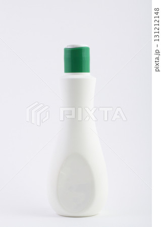 White plastic detergent bottle green cap isolated no background studio lighting 131212148