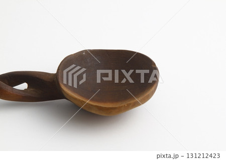 Empty spoon made of wood on white background. Top view. 131212423
