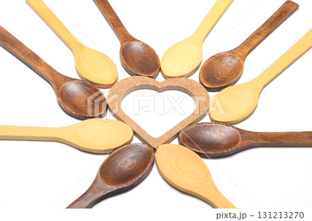 Wooden spoon on a white background. Wooden dishes. Isolate on a white background. Wooden spoon on a white background. Wooden dishes. Isolate on a white background. 131213270