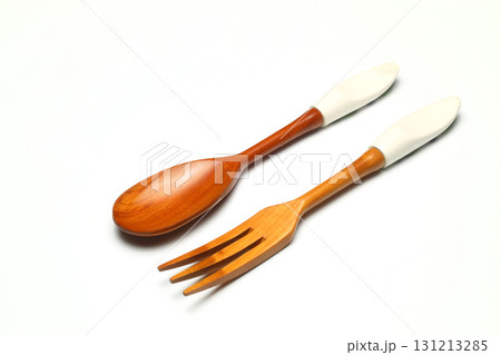 Wooden spoon on a white background. Wooden dishes. Isolate on a white background. Wooden spoon on a white background. Wooden dishes. Isolate on a white background. 131213285