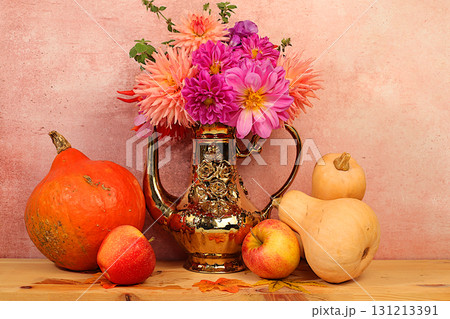Autumn floral arrangement with dahlias in a vase, abstract still life with apples, pumpkins, and flowers, Thanksgiving holiday banner, autumn greeting. A cozy mood composition 131213391
